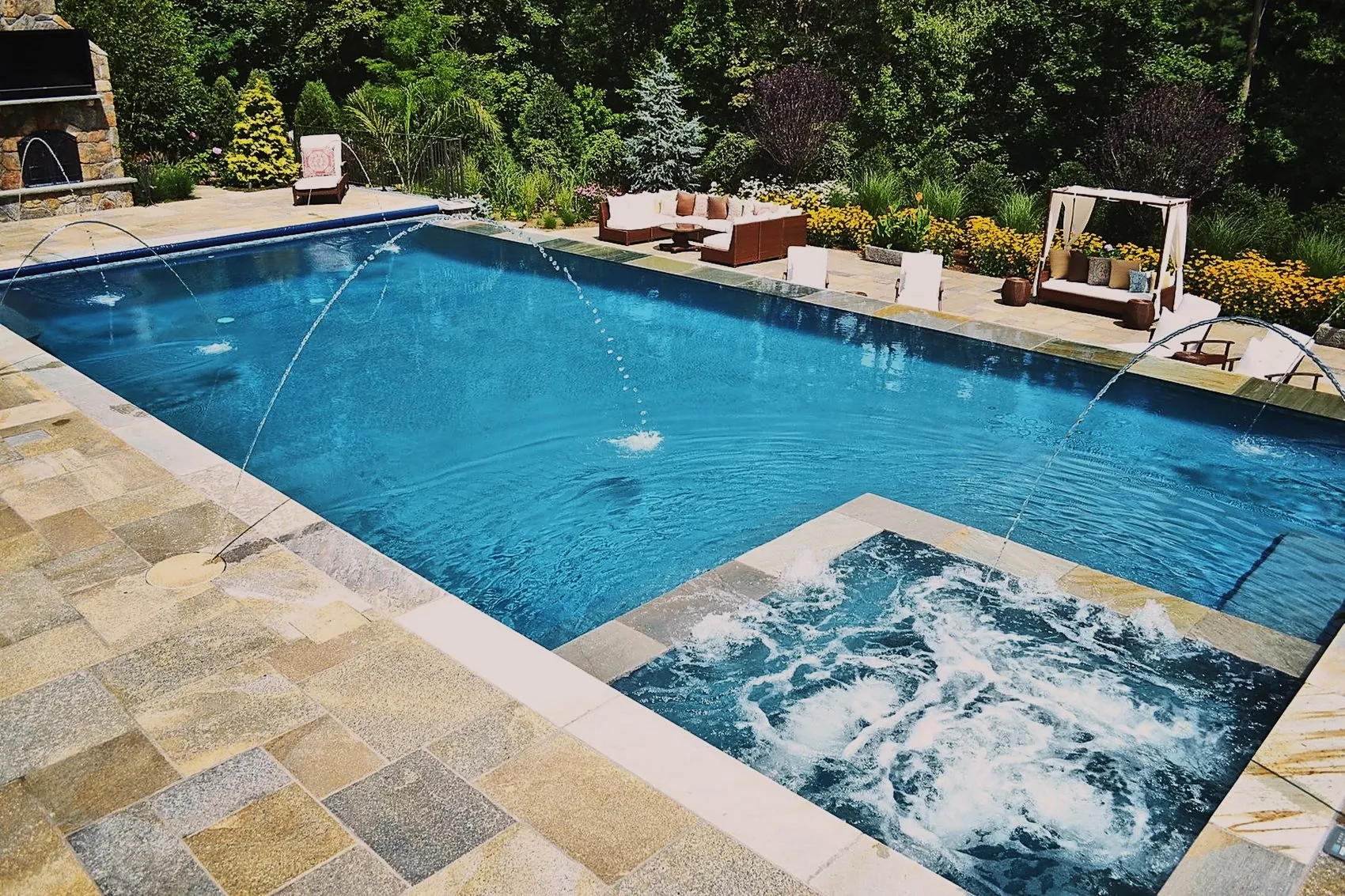 Custom gunite pool with deck jets and spa